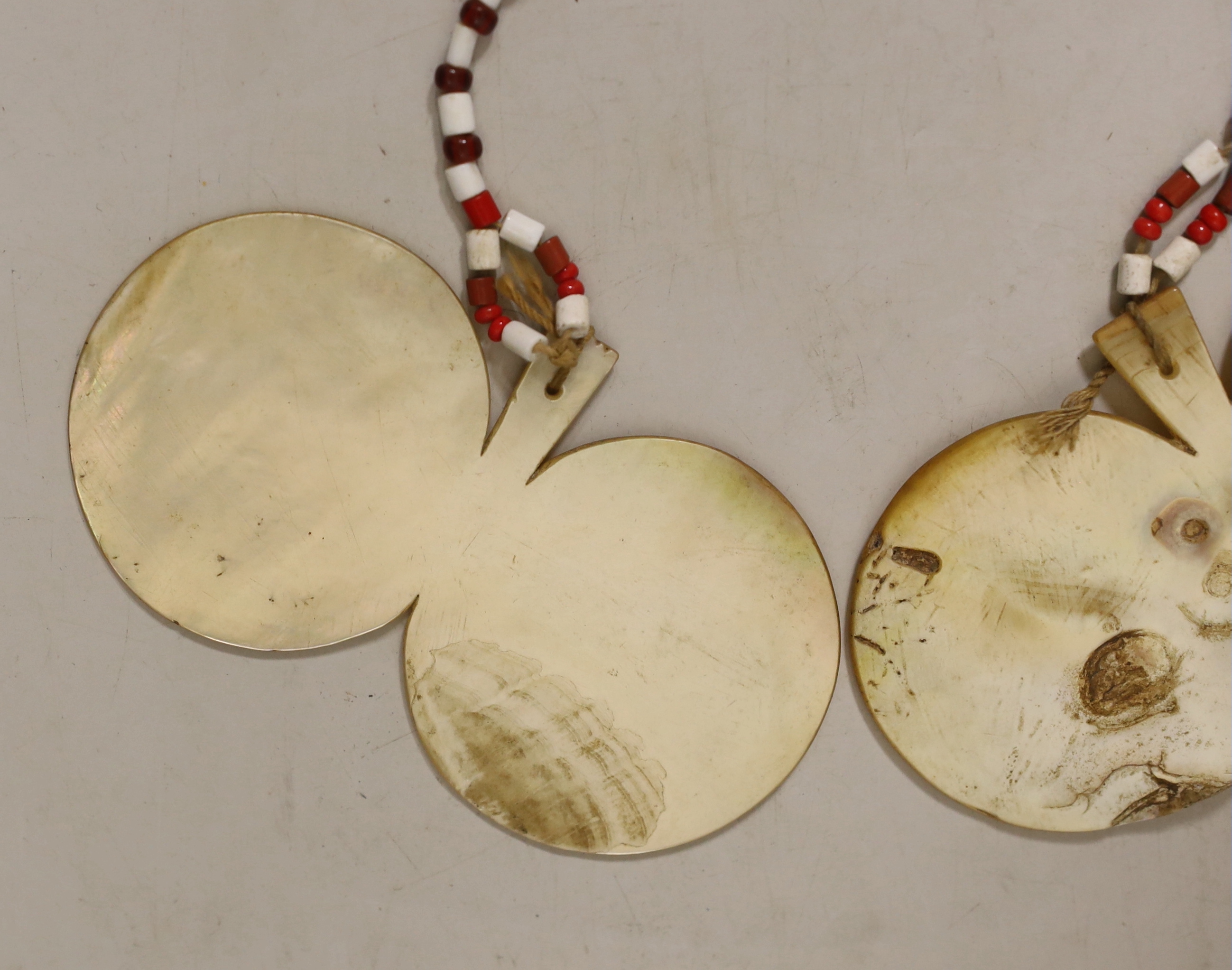 A pair of Philippines mother of pearl bawisak earrings, Naga tribe, each 11.5cm. Provenance – a European Private collection, thence by family descent. Ethnographica from the same collection was sold by Sotheby’s, Paris,